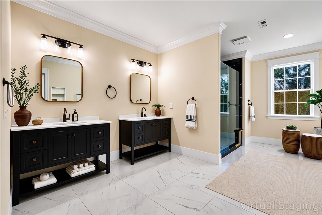 303 Regency Circle Anderson, SC 29625 - Photo 19 of 50 This spacious bathroom offers dual vanities and a sleek walk-in shower for a refreshing start to your day.