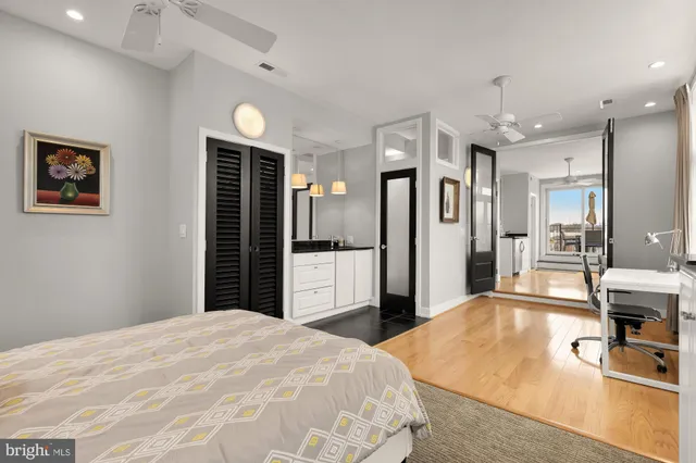 a bedroom with a bed and a view of bathroom