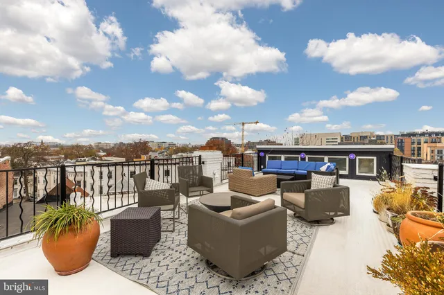 a view of a terrace with furniture