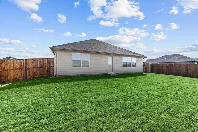 a view of a house with a back yard