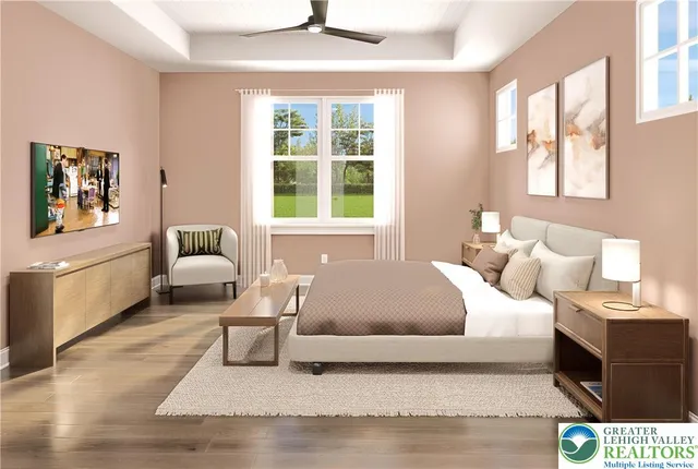 a living room with a bed furniture and a window