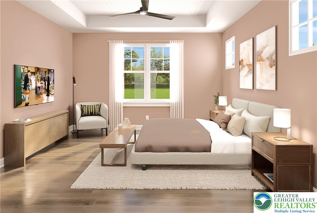 3 Grantarthur Court, Unit LIBERTY Whitehall, PA 18052 - Photo 11 of 21 a living room with a bed furniture and a window