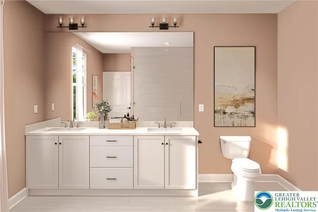 a bathroom with a sink a toilet and a mirror