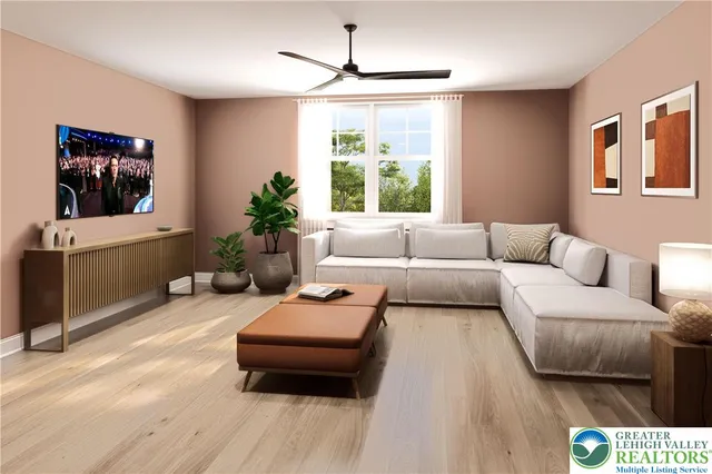 a living room with furniture and a flat screen tv