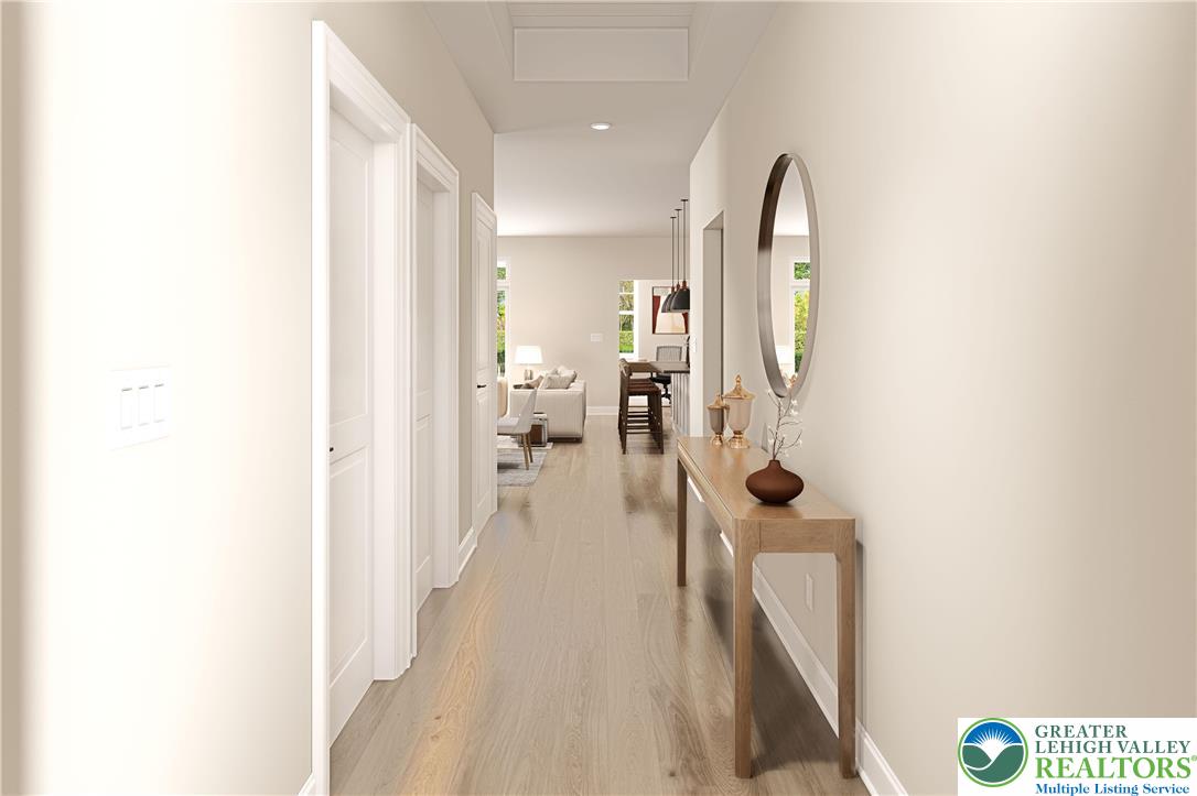 3 Grantarthur Court, Unit LIBERTY Whitehall, PA 18052 - Photo 4 of 21 a living room with furniture and a wooden floor