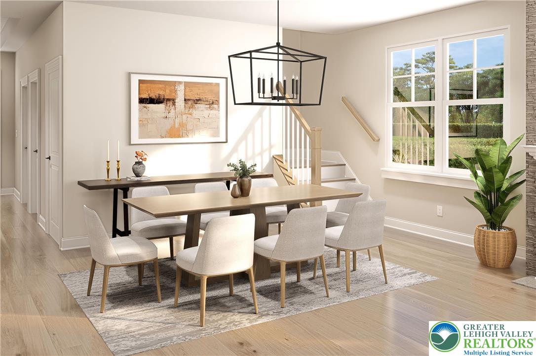 3 Grantarthur Court, Unit LIBERTY Whitehall, PA 18052 - Photo 5 of 21 a view of a dining room with furniture and wooden floor