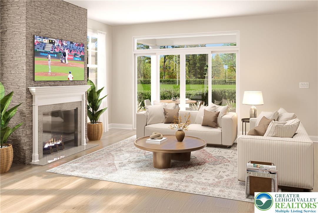 3 Grantarthur Court, Unit LIBERTY Whitehall, PA 18052 - Photo 6 of 21 a living room with furniture and a fireplace
