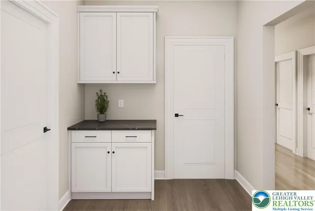 a view of cabinets and wooden floor