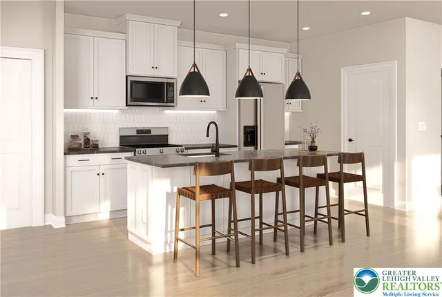 a kitchen with stainless steel appliances kitchen island granite countertop a stove a sink a dining table and chairs with wooden floor