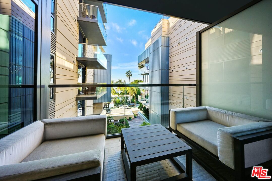 1755 Ocean Avenue, Unit 602 Santa Monica, CA 90401 - Photo 13 of 26 a living room with furniture and a kitchen view