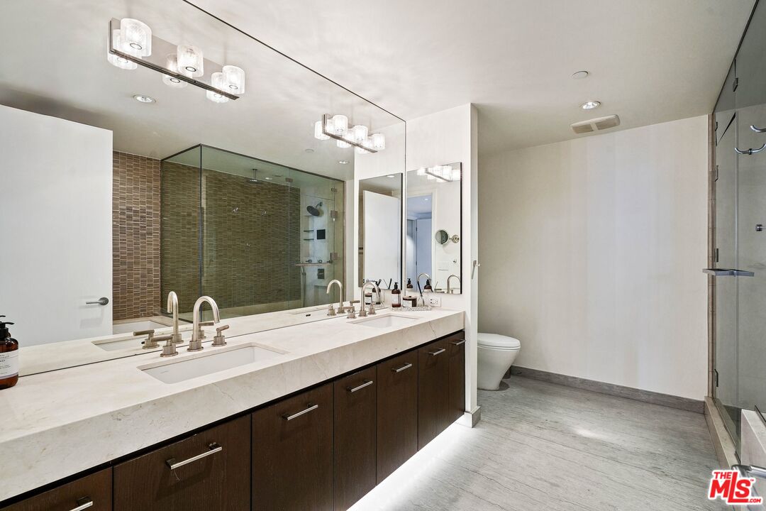 1755 Ocean Avenue, Unit 602 Santa Monica, CA 90401 - Photo 14 of 26 a bathroom with a double vanity sink mirror and double