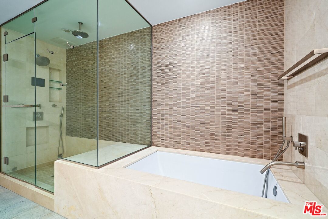 1755 Ocean Avenue, Unit 602 Santa Monica, CA 90401 - Photo 15 of 26 a bathroom with a bathtub and shower
