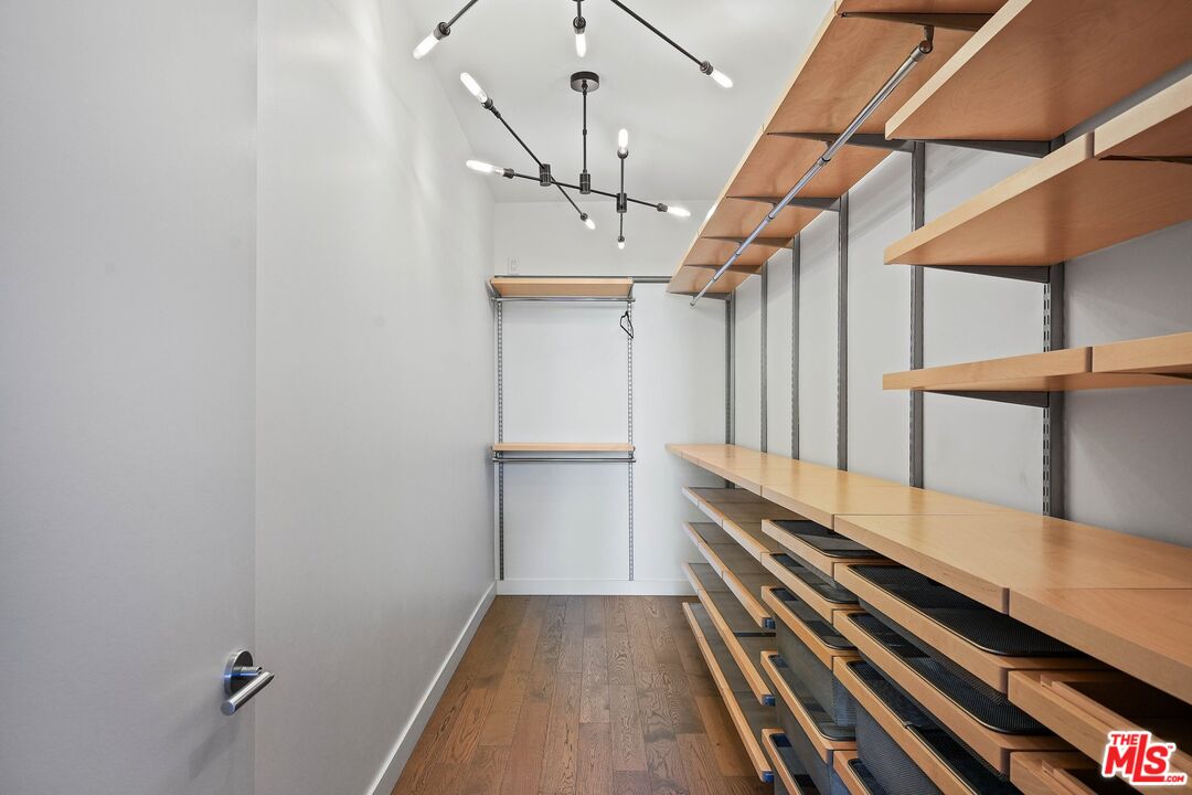1755 Ocean Avenue, Unit 602 Santa Monica, CA 90401 - Photo 16 of 26 a view of a room with wooden floor