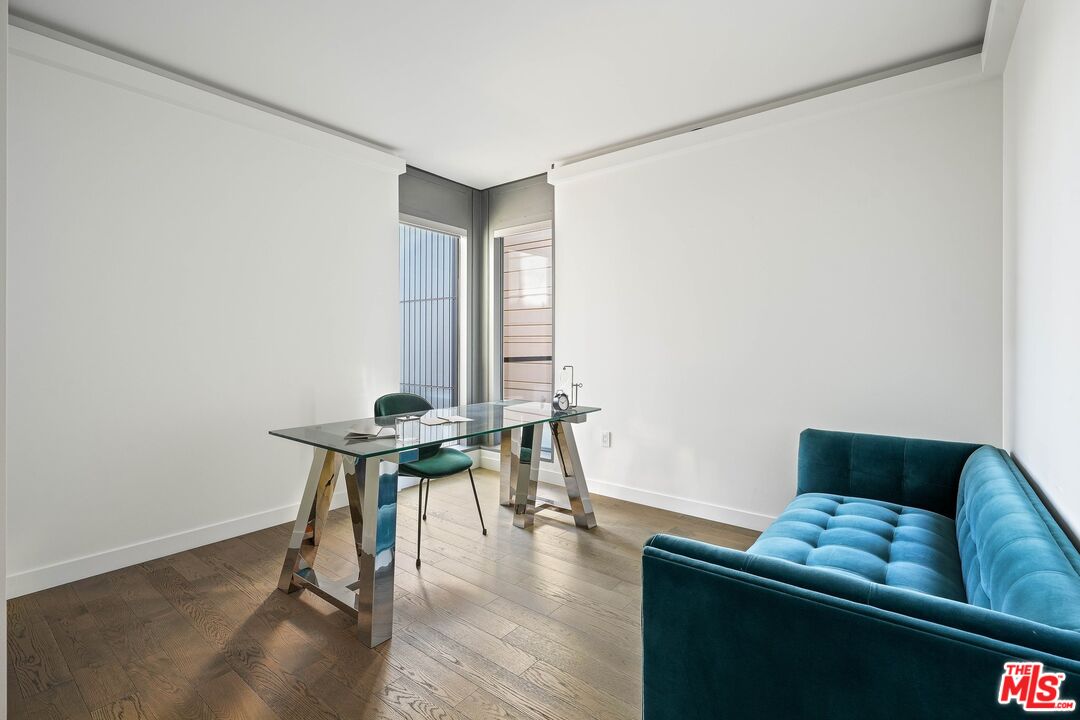 1755 Ocean Avenue, Unit 602 Santa Monica, CA 90401 - Photo 17 of 26 a living room with furniture and a wooden floor