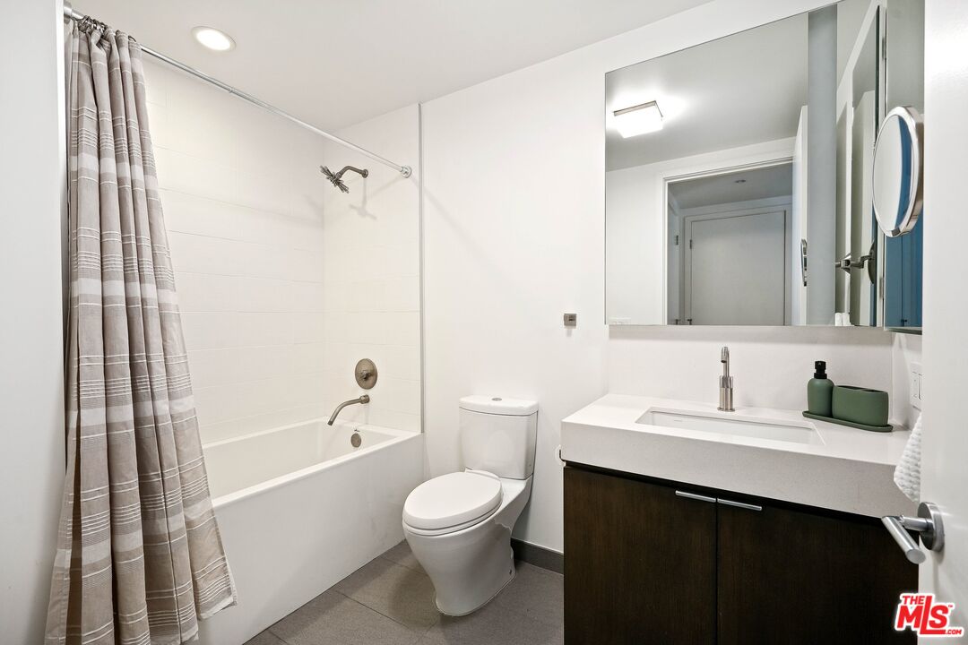 1755 Ocean Avenue, Unit 602 Santa Monica, CA 90401 - Photo 18 of 26 a bathroom with a sink a toilet and shower