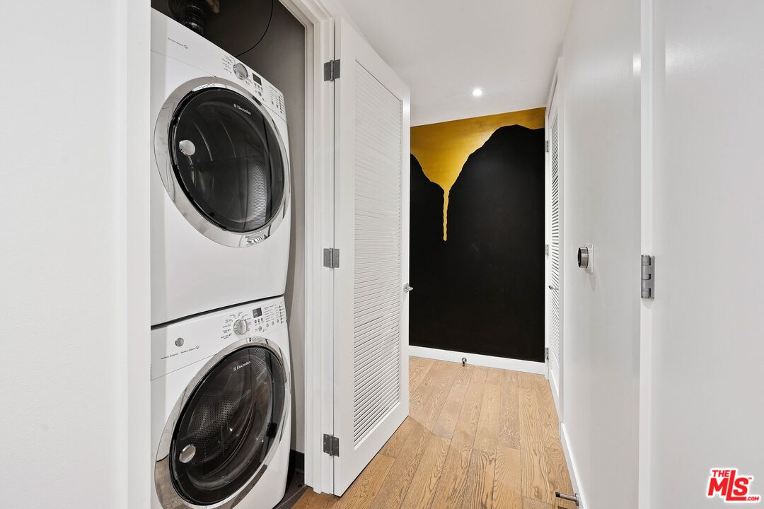 1755 Ocean Avenue, Unit 602 Santa Monica, CA 90401 - Photo 19 of 26 a view of a hallway with washer and dryer