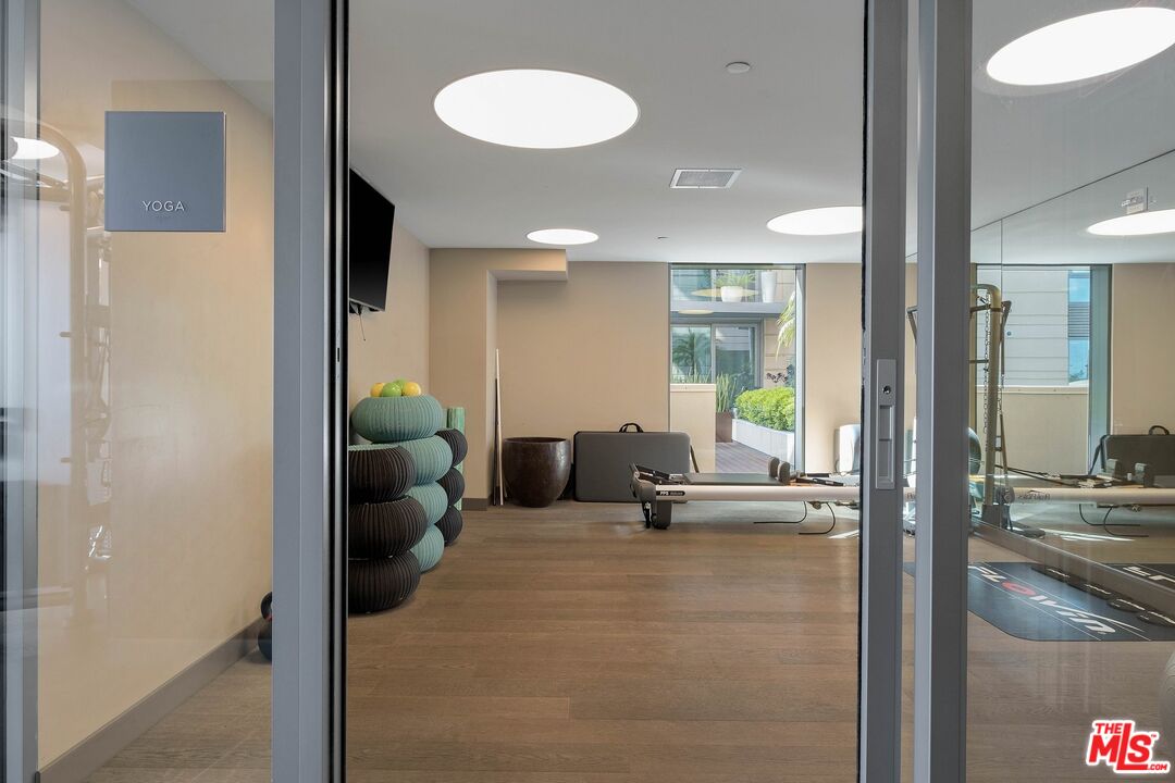 1755 Ocean Avenue, Unit 602 Santa Monica, CA 90401 - Photo 26 of 26 a living room with furniture and a large window