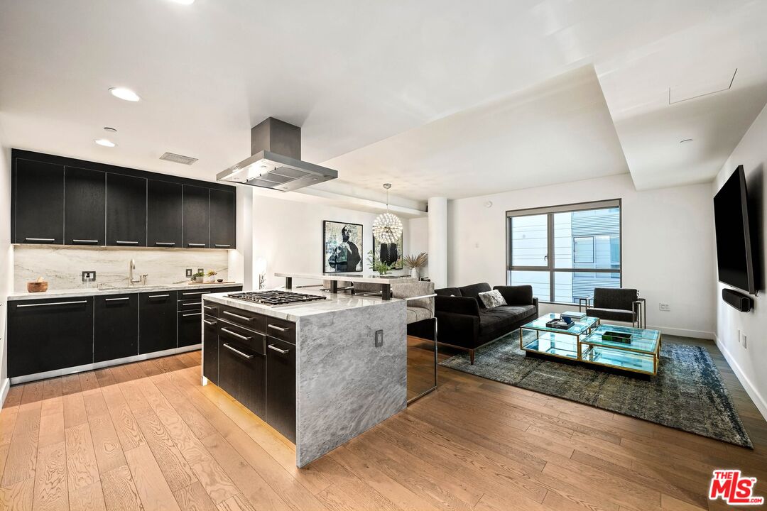 1755 Ocean Avenue, Unit 602 Santa Monica, CA 90401 - Photo 3 of 26 a kitchen with a stove and a microwave