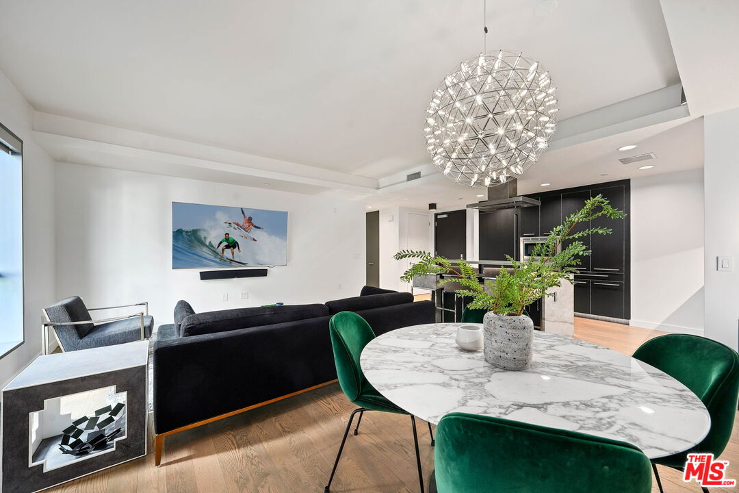 1755 Ocean Avenue, Unit 602 Santa Monica, CA 90401 - Photo 8 of 26 a view of a dining room with furniture window and wooden floor