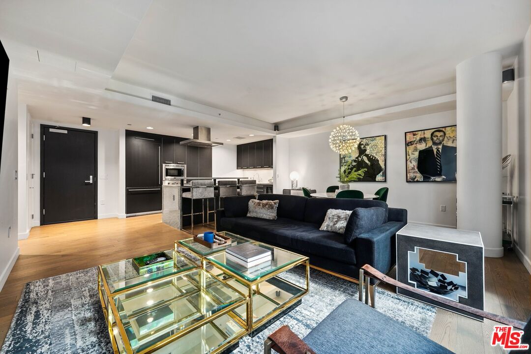 1755 Ocean Avenue, Unit 602 Santa Monica, CA 90401 - Photo 9 of 26 a living room with furniture and a fireplace