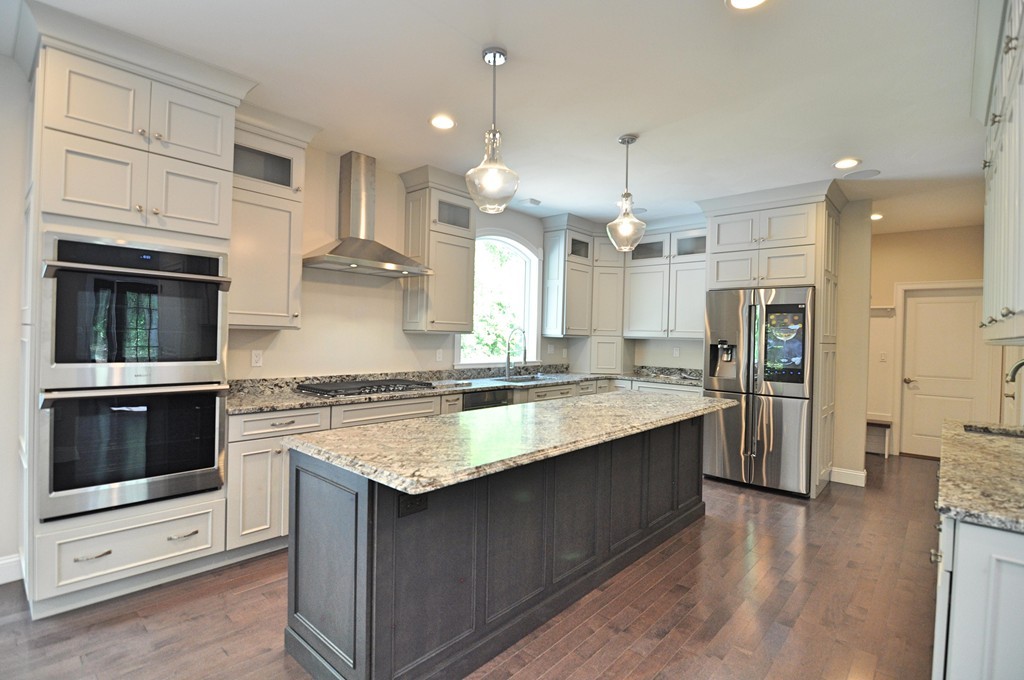 8 Maple Street Dunstable, MA 01827 - Photo 3 of 29 a kitchen with a sink stove and refrigerator