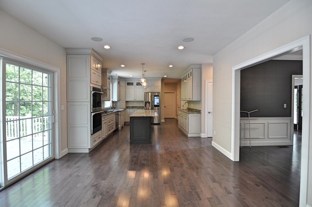 8 Maple Street Dunstable, MA 01827 - Photo 6 of 29 a view of kitchen dining table chairs cabinets and stainless steel appliances