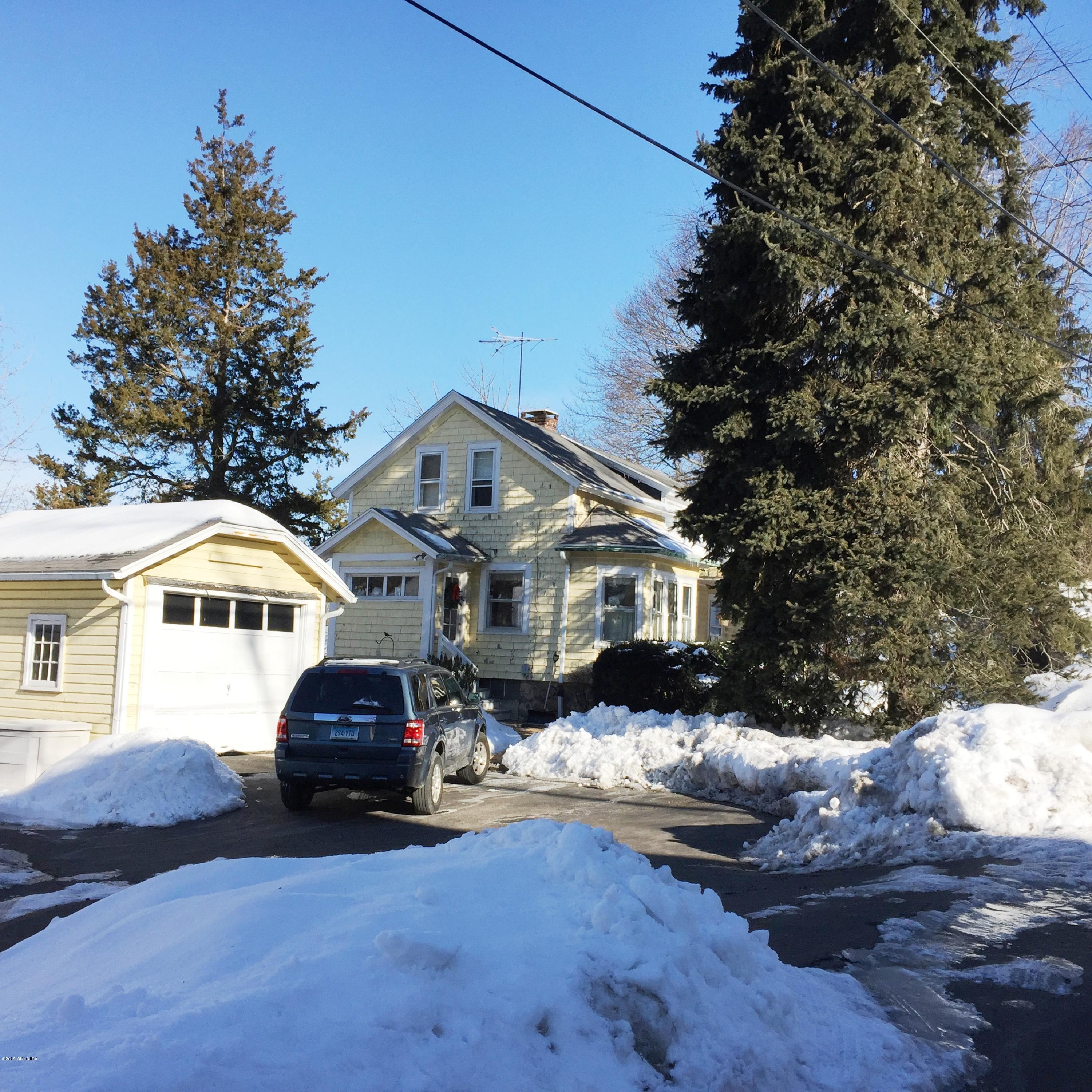 8 West View Place Riverside, CT 06878 - Photo 2 of 11 a front view of a house with a yard
