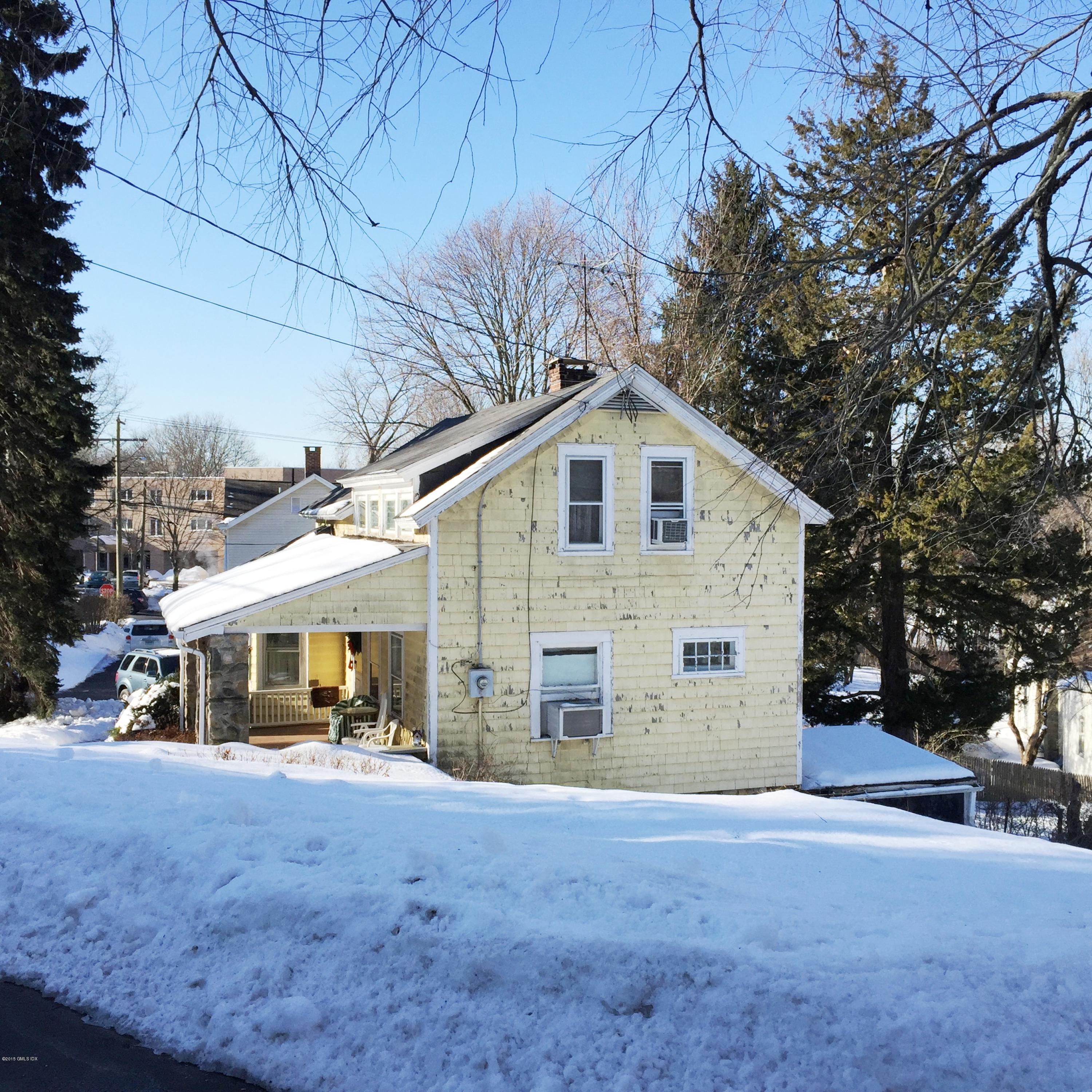 8 West View Place Riverside, CT 06878 - Photo 4 of 11 a view of a house with a yard and garage