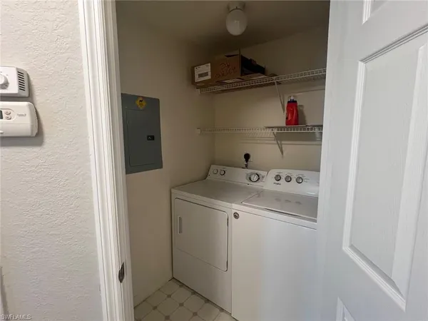 a white toilet sitting next to a bath tub