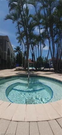 a view of a swimming pool with sitting area