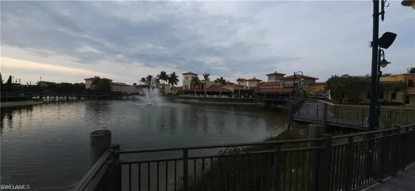 a view of a swimming pool with outdoor seating