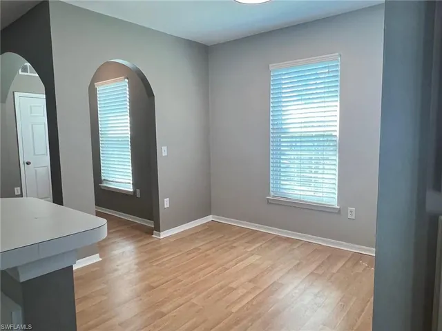 a view of a kitchen with wooden floor
