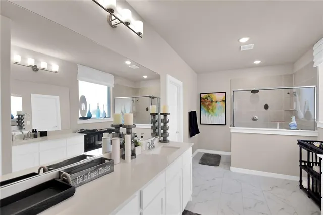 a large kitchen with lots of counter space and furniture