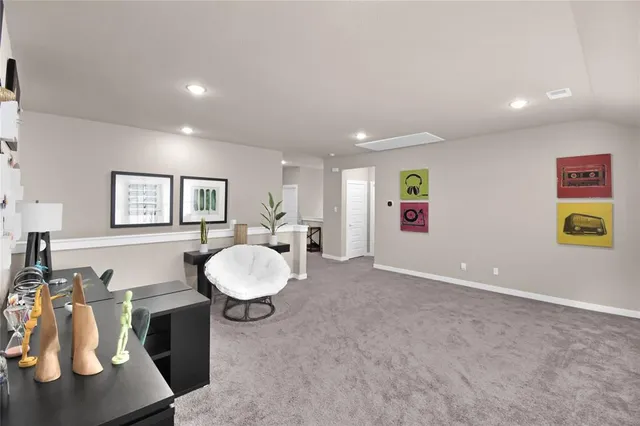 a view of a livingroom with furniture and a window