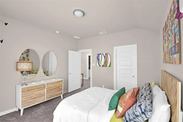 a bedroom with bed and a window