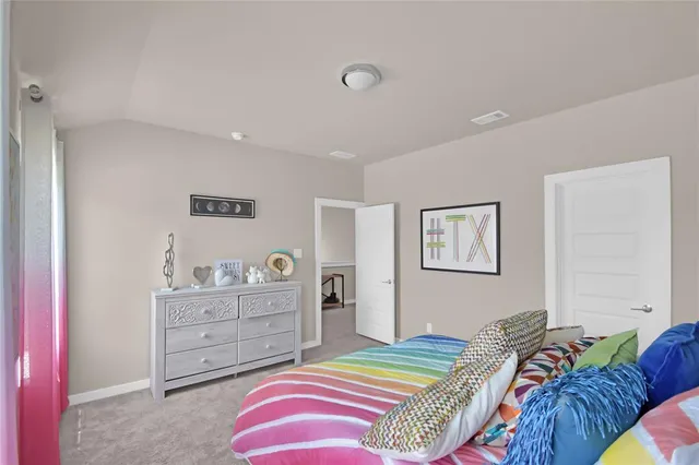 a bedroom with a bed and a closet