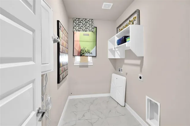 a view of hallway with furniture and a window