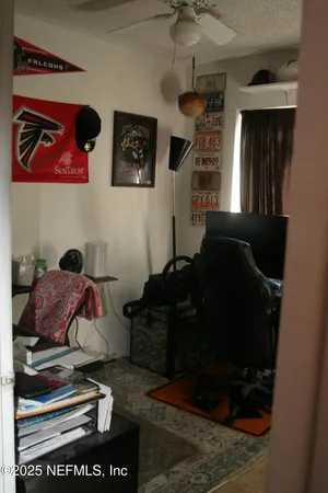 a living room with furniture and a closet