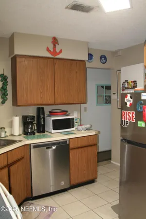 a kitchen with stainless steel appliances granite countertop a stove and a refrigerator