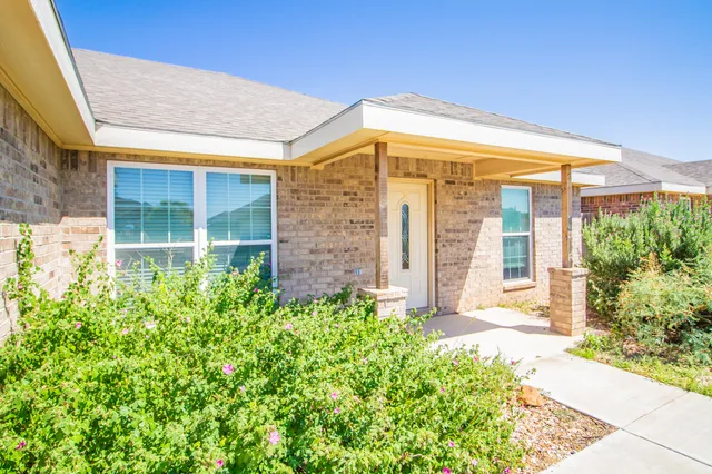 a view of a back yard of the house
