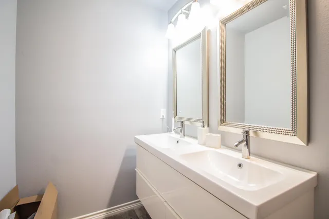 a bathroom with a sink and a mirror