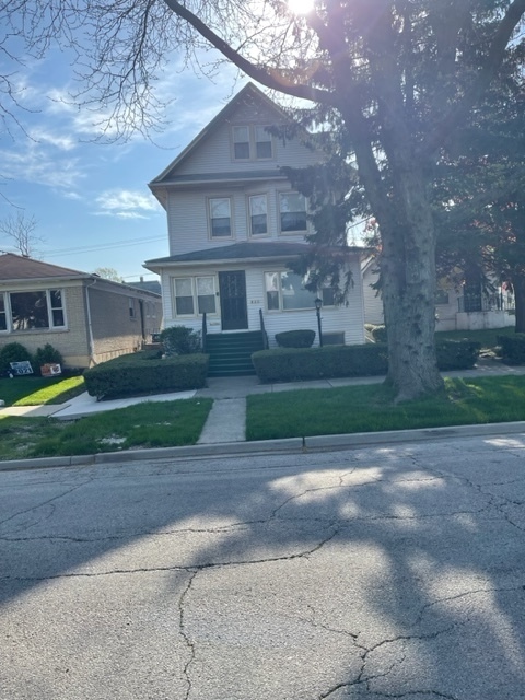 Undisclosed Address Maywood, IL 60153 - Photo 1 of 46 a view of a big house with a yard and plants
