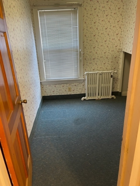 Undisclosed Address Maywood, IL 60153 - Photo 18 of 46 a view of a room with a window