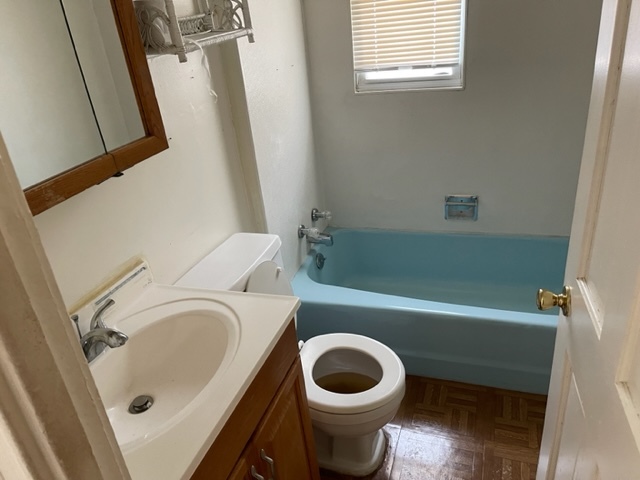 Undisclosed Address Maywood, IL 60153 - Photo 36 of 46 a bathroom with a sink a toilet and bathtub
