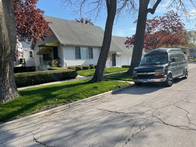 Undisclosed Address Maywood, IL 60153 - Photo 4 of 46 a car parked in front of a house