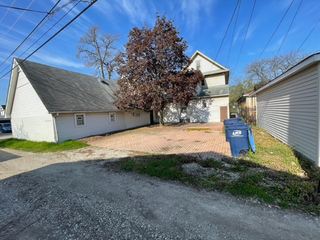 Undisclosed Address Maywood, IL 60153 - Photo 7 of 46 a view of a house with a yard