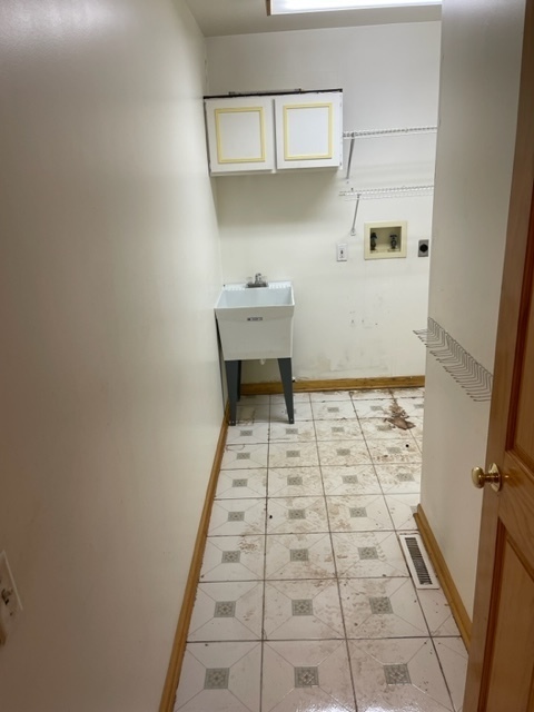 Undisclosed Address Maywood, IL 60153 - Photo 10 of 46 a bathroom with a sink a toilet and a mirror