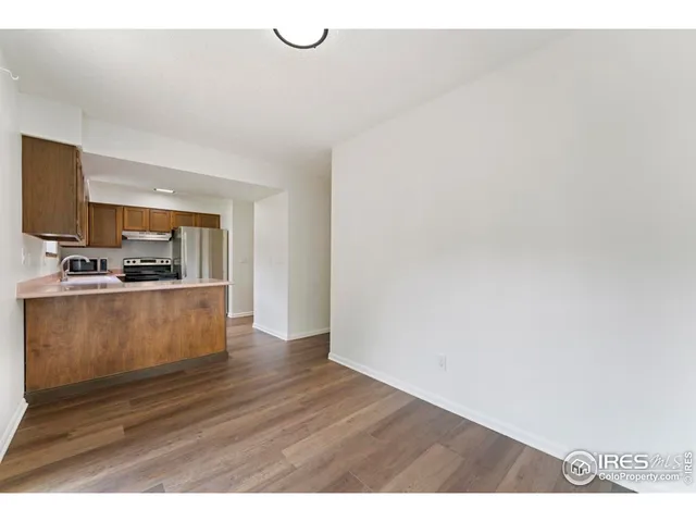 a view of kitchen with wooden floor