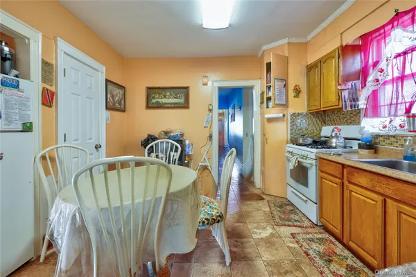 a room with water heater and a refrigerator