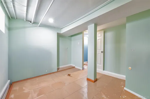 a bedroom with a bed and a elevator